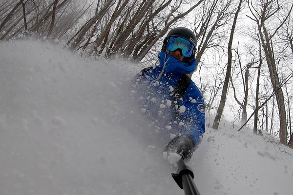 Riding deep powder in the backcountry of Madarao Mountain Resort